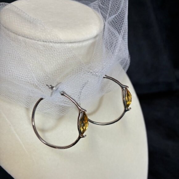 Silver tone hoop earrings with yellow rhinestones. - Picture 2 of 4